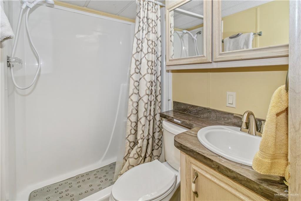 2800 Turner Road San Benito, TX 78586 - Photo 18 of 18 a bathroom with a sink a toilet and shower