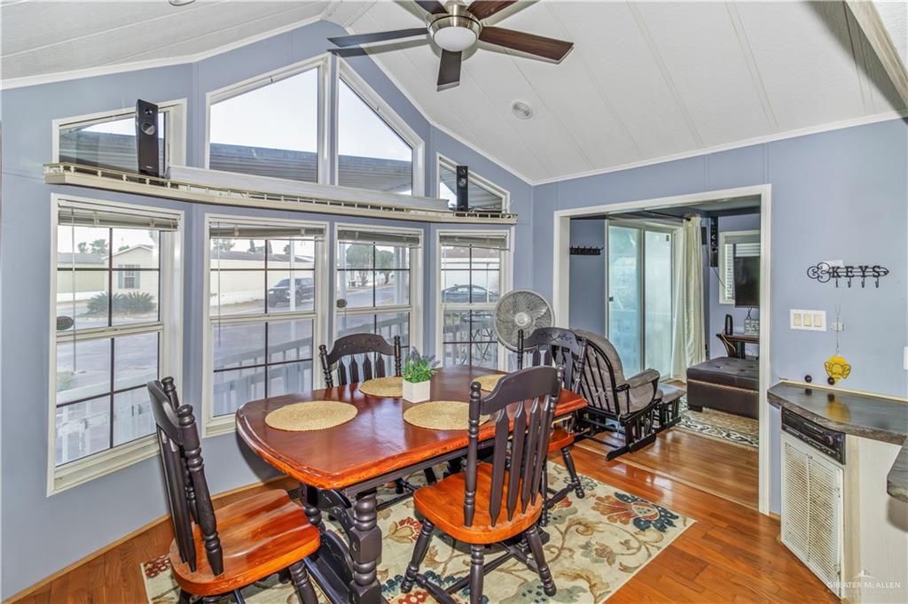 2800 Turner Road San Benito, TX 78586 - Photo 3 of 18 a dining room with furniture a chandelier and wooden floor