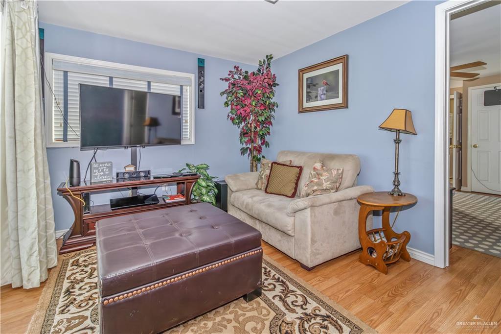 2800 Turner Road San Benito, TX 78586 - Photo 8 of 18 a living room with furniture and a potted plant