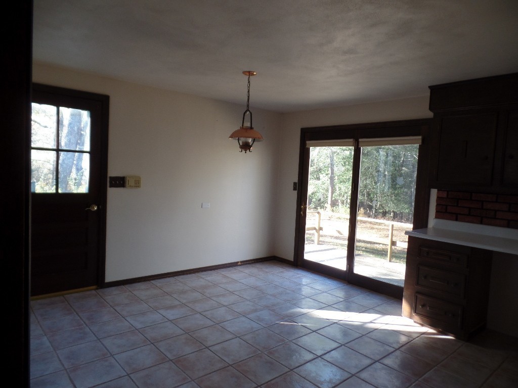 501 Walnut Plain Road Rochester, MA 02770 - Photo 4 of 8 a view of empty room with wooden floor and fan