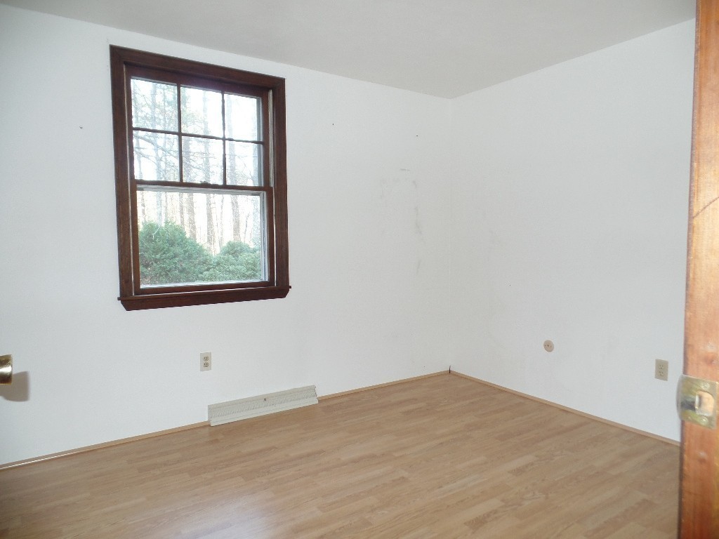 501 Walnut Plain Road Rochester, MA 02770 - Photo 6 of 8 an empty room with a window