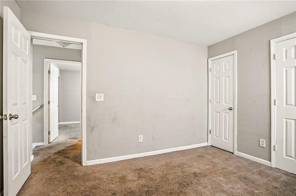 4611 Raven Wood Loop Union City, GA 30291 - Photo 16 of 24 an empty room with closet and a bathroom