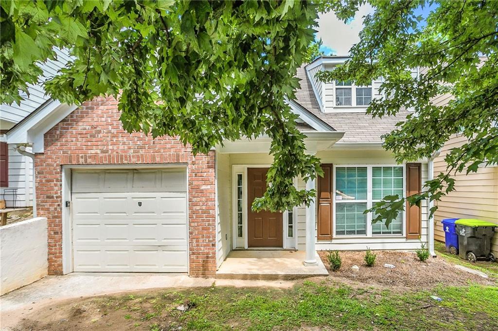 4611 Raven Wood Loop Union City, GA 30291 - Photo 2 of 24 front view of a house with a tree