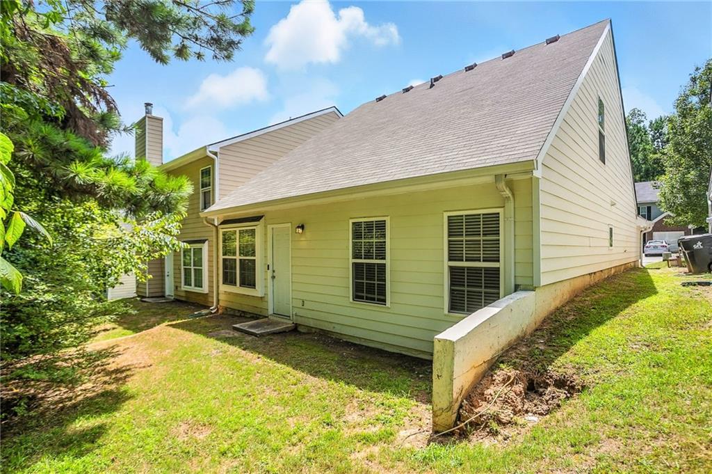 4611 Raven Wood Loop Union City, GA 30291 - Photo 21 of 24 a view of a house with a yard