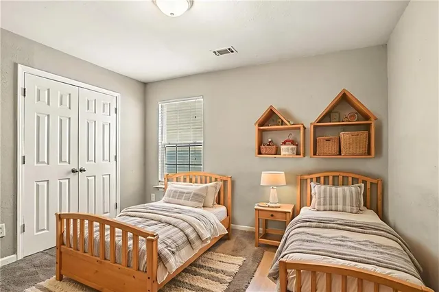 a bedroom with bed and a window