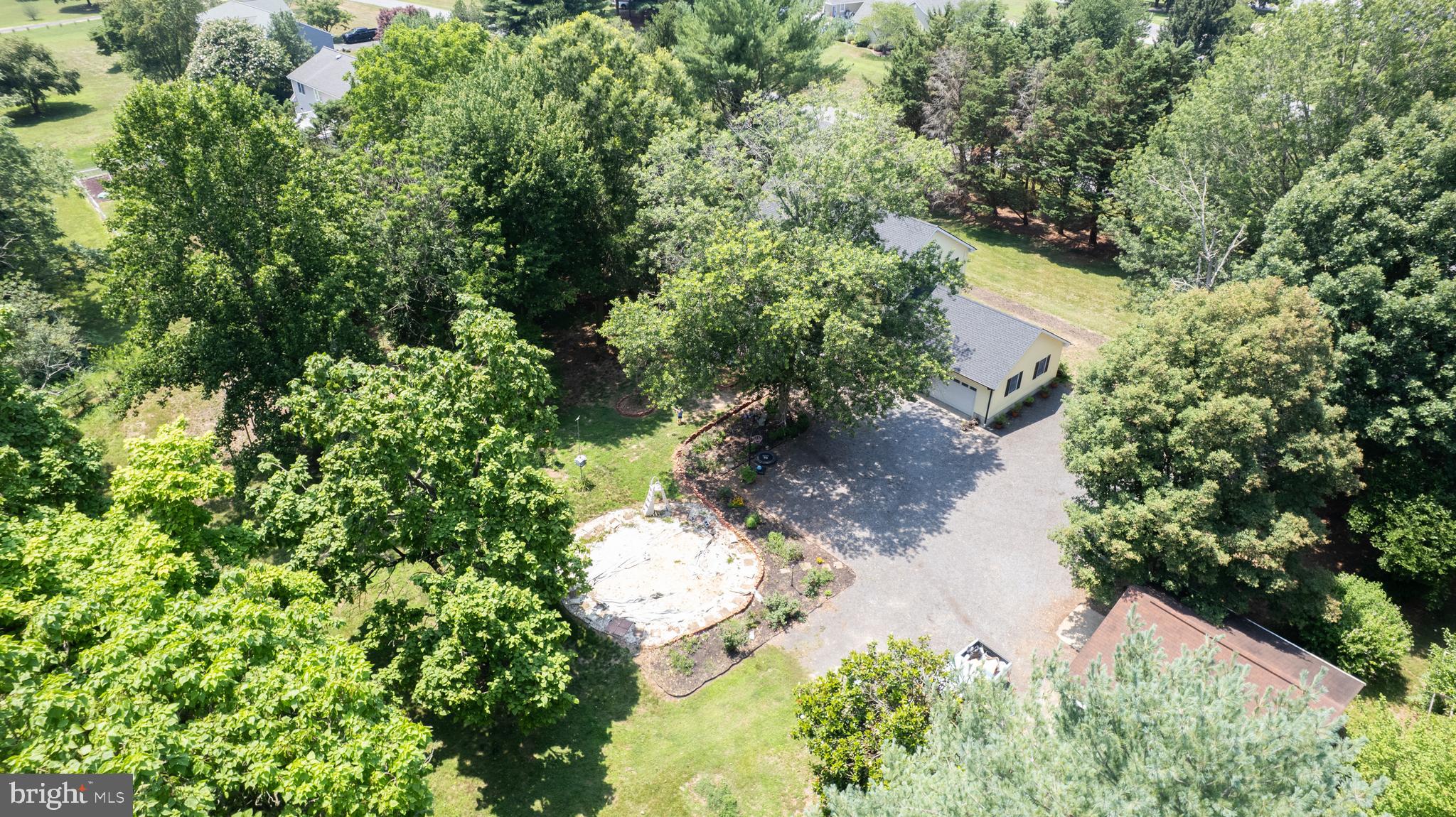 9472 Quail Run Road Denton, MD 21629 - Photo 47 of 50 an aerial view of a house with a yard