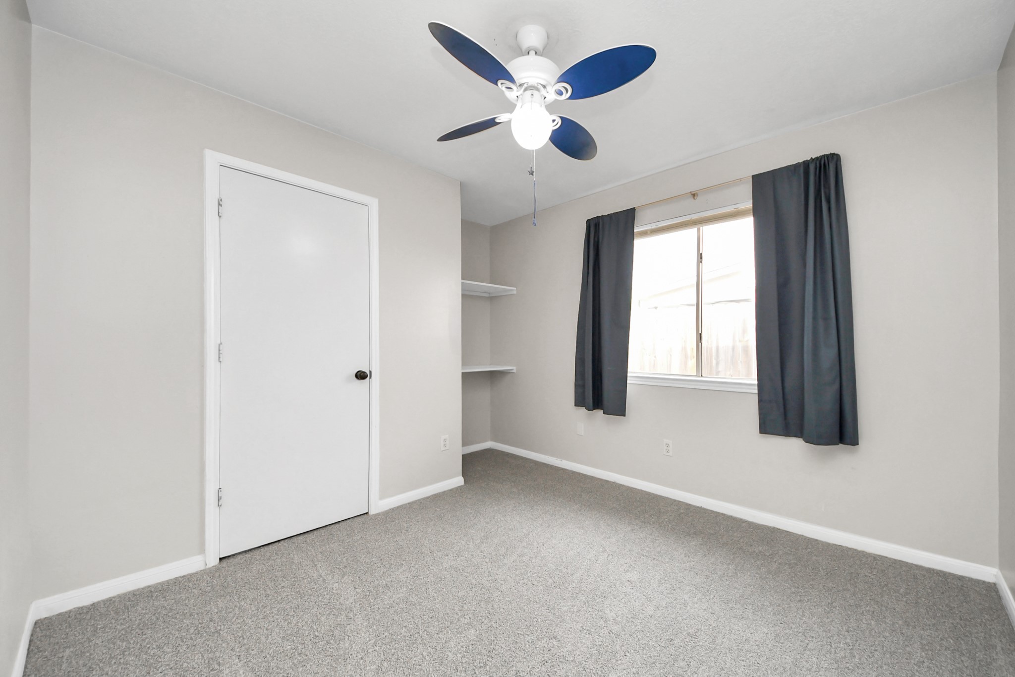28707 Stapleford Street Spring, TX 77386 - Photo 29 of 38 an empty room with ceiling fan and windows