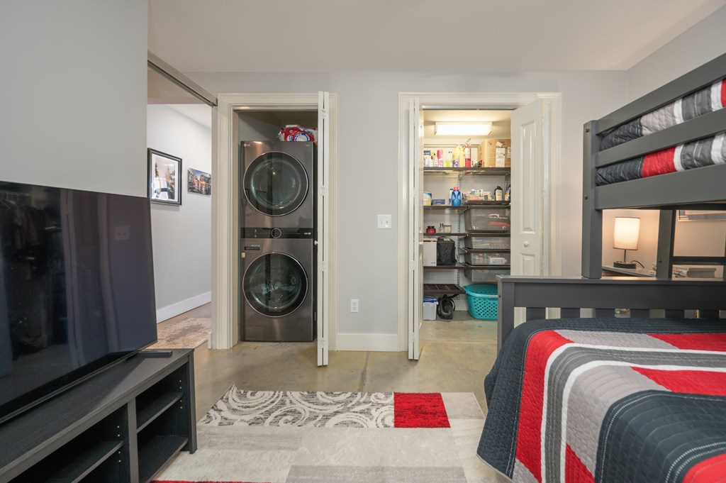 1201 Front Avenue, Unit 509 Columbus, GA 31901 - Photo 12 of 41 a view of walk in closet with clothes and shoes