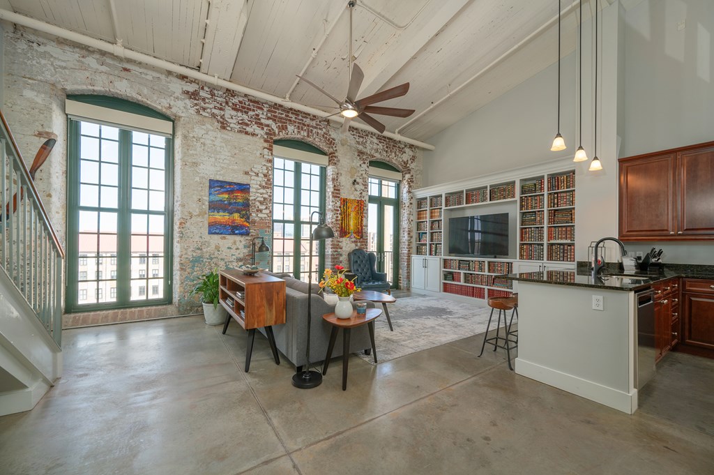 1201 Front Avenue, Unit 509 Columbus, GA 31901 - Photo 13 of 41 a living room with patio furniture and a flat screen tv