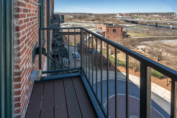 a view of a balcony with city view