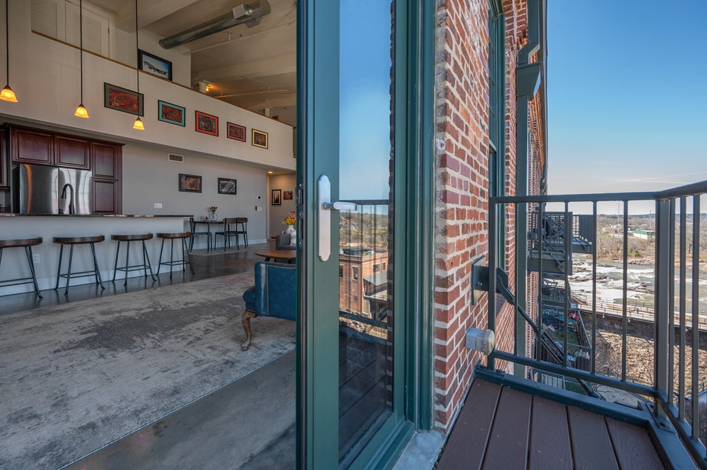 1201 Front Avenue, Unit 509 Columbus, GA 31901 - Photo 17 of 41 a view of a balcony with wooden floor