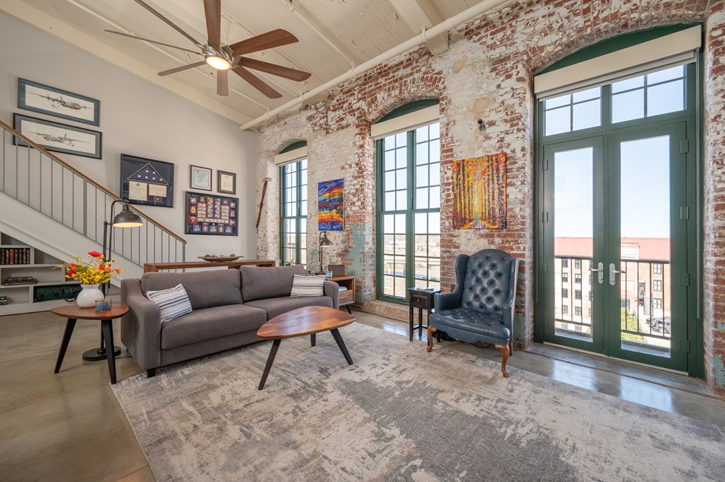 1201 Front Avenue, Unit 509 Columbus, GA 31901 - Photo 20 of 41 a living room with furniture and a window