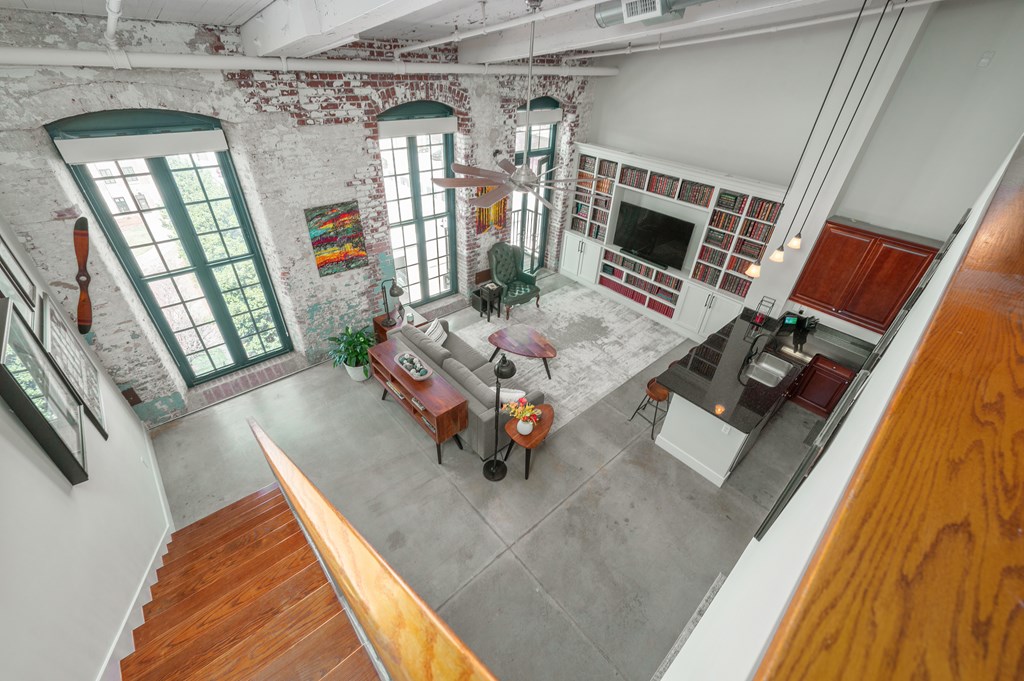 1201 Front Avenue, Unit 509 Columbus, GA 31901 - Photo 30 of 41 a living room with furniture fireplace and flat screen tv