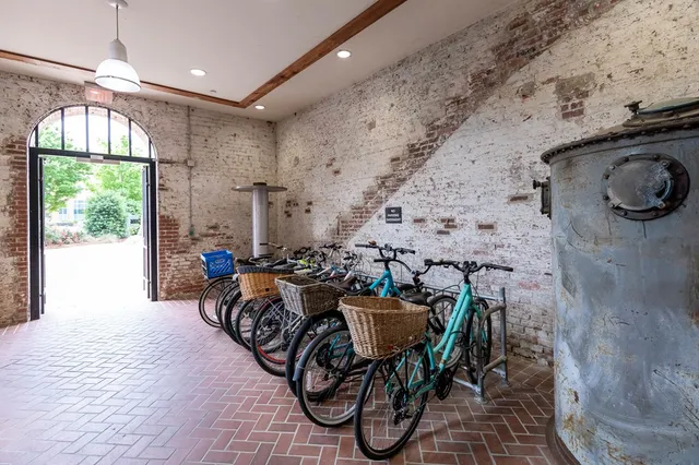 a living room with furniture a window and a table