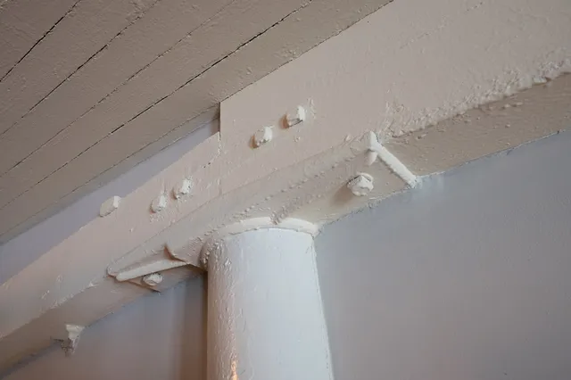 a view of a room that has white walls and utility room