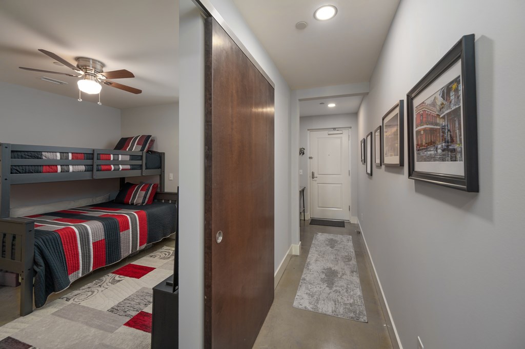 1201 Front Avenue, Unit 509 Columbus, GA 31901 - Photo 8 of 41 a view of a hallway and a livingroom with furniture