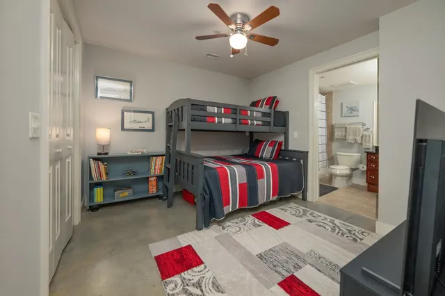 a bedroom with a bed closet and a window