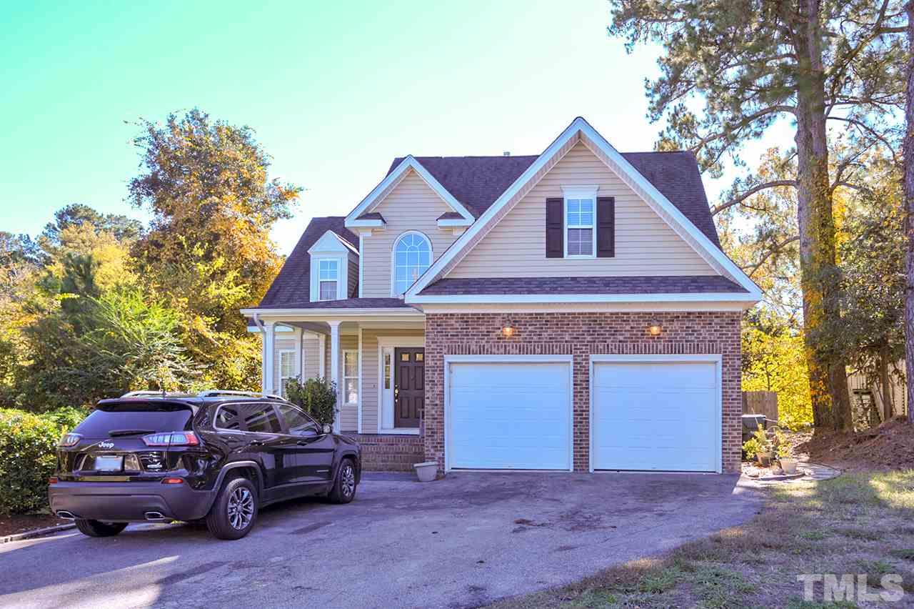 4604 Old Poole Road Raleigh, NC 27610 - Photo 1 of 14 a view of a house with a cars parking space