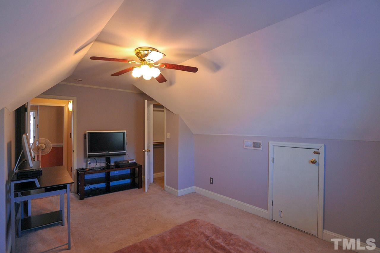 4604 Old Poole Road Raleigh, NC 27610 - Photo 11 of 14 a living room with furniture and a flat screen tv