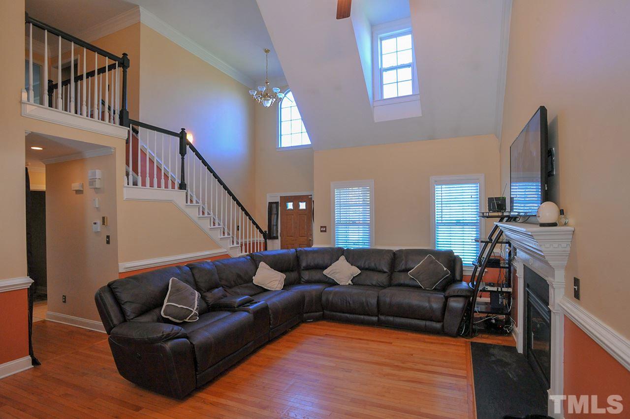 4604 Old Poole Road Raleigh, NC 27610 - Photo 3 of 14 a living room with furniture and a flat screen tv