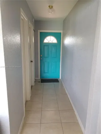 a view of hallway with closet