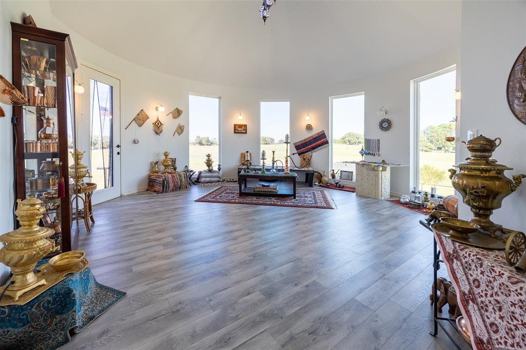 2630 Rockhill Road Aubrey, TX 76227 - Photo 27 of 36 a living room with furniture and wooden floor