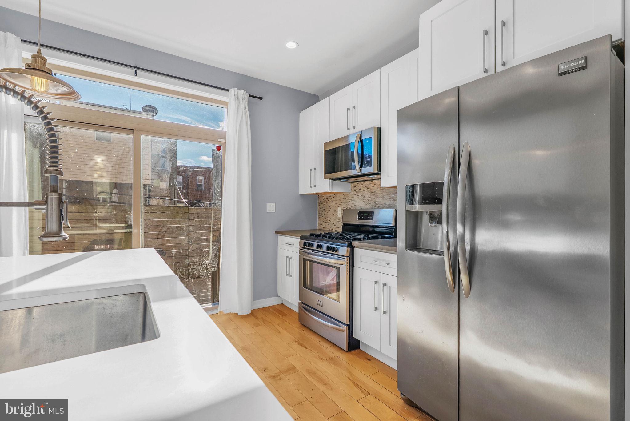 1912 Gerritt Street Philadelphia, PA 19146 - Photo 11 of 40 a kitchen with a refrigerator and a sink