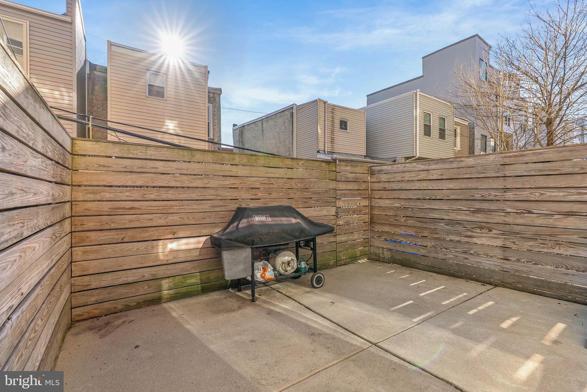 1912 Gerritt Street Philadelphia, PA 19146 - Photo 14 of 40 a view of a patio with table and chairs and iron fence