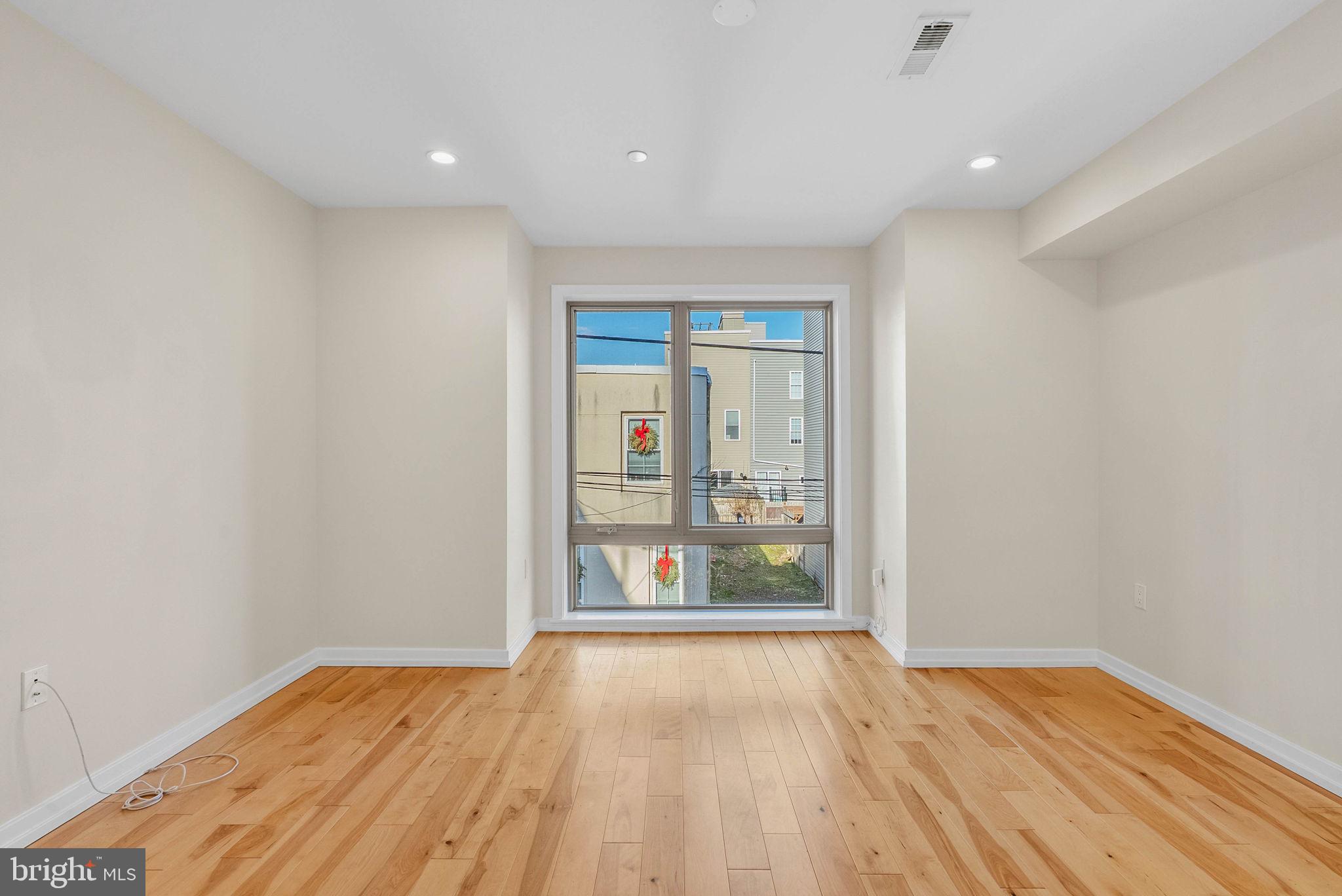 1912 Gerritt Street Philadelphia, PA 19146 - Photo 17 of 40 an empty room with wooden floor and windows