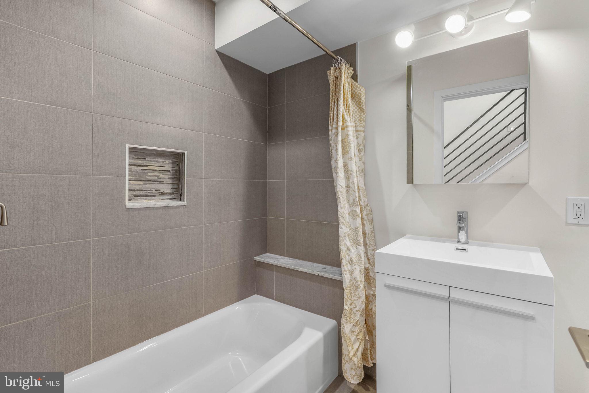 1912 Gerritt Street Philadelphia, PA 19146 - Photo 19 of 40 a bathroom with a sink a toilet and shower