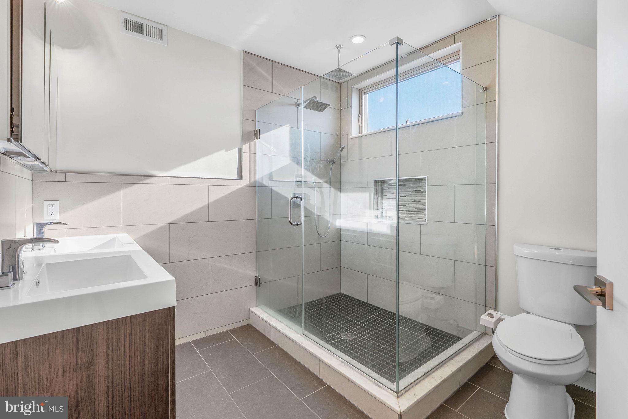 1912 Gerritt Street Philadelphia, PA 19146 - Photo 27 of 40 a bathroom with a sink toilet and shower