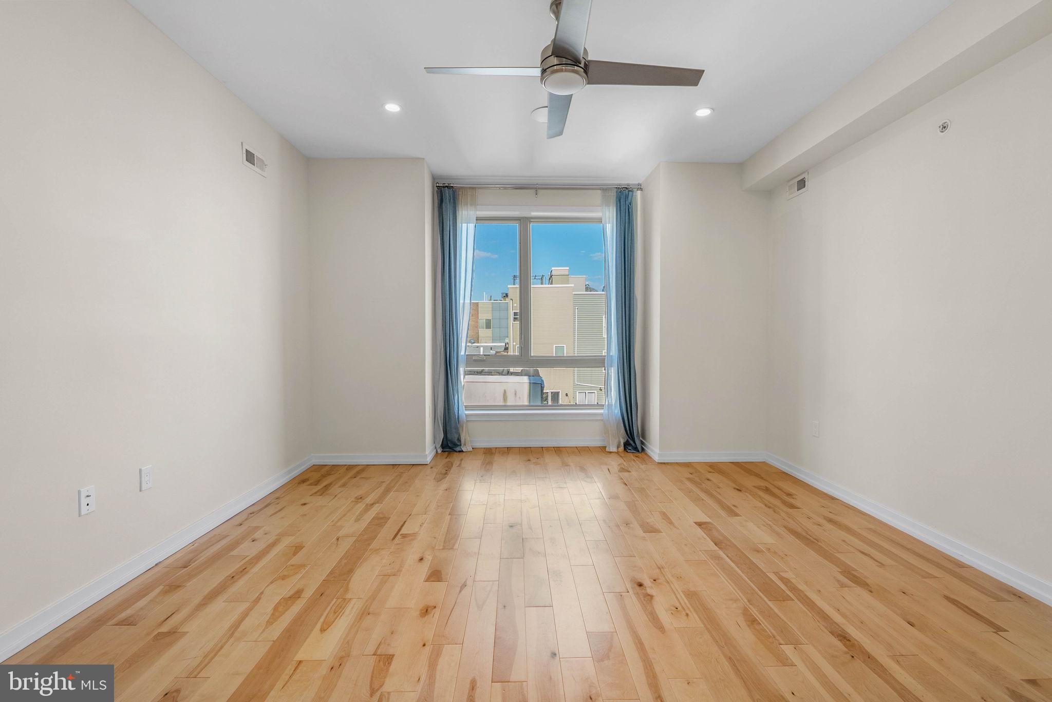 1912 Gerritt Street Philadelphia, PA 19146 - Photo 29 of 40 a view of an empty room with wooden floor and a window