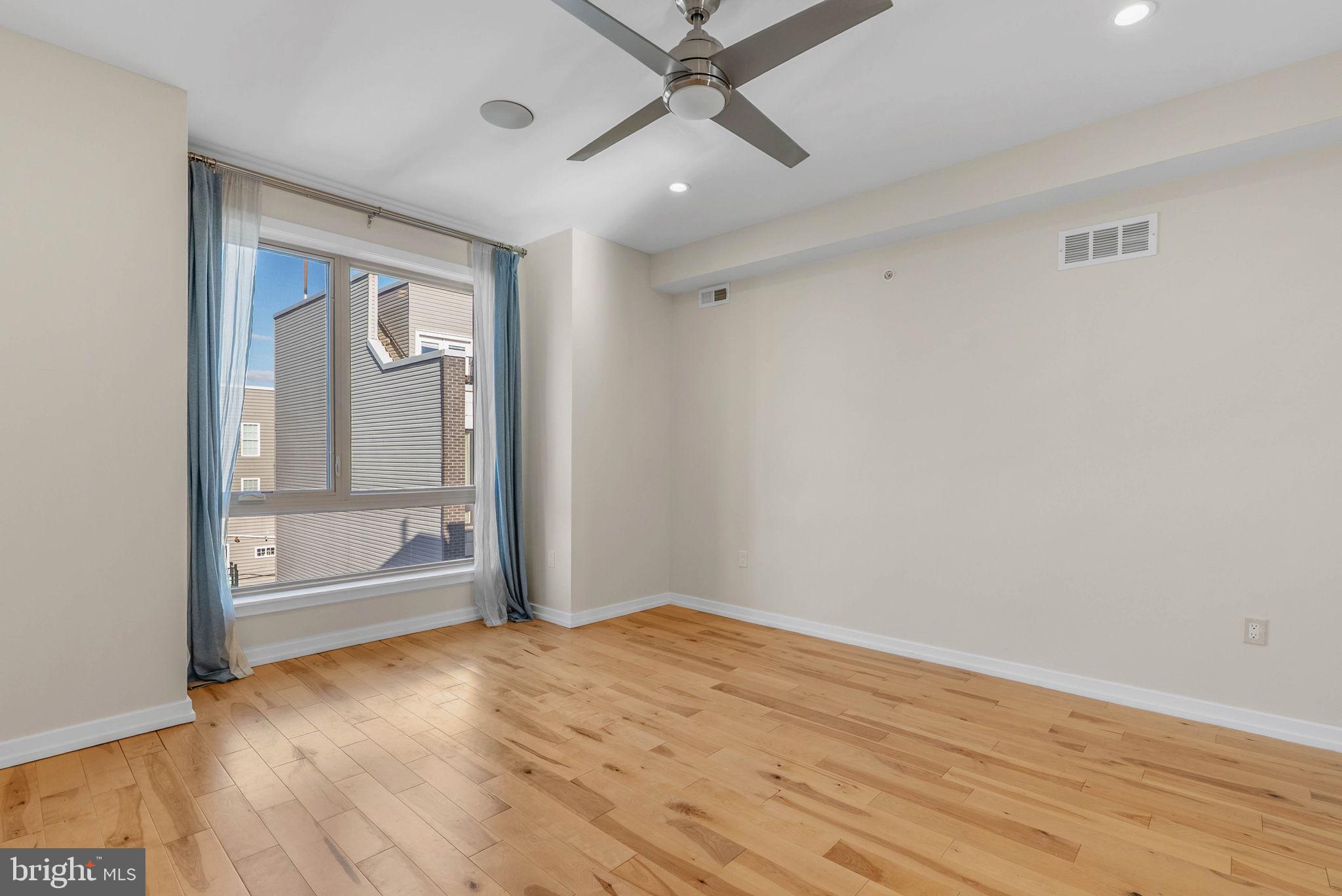 1912 Gerritt Street Philadelphia, PA 19146 - Photo 30 of 40 an empty room with wooden floor cabinet and windows
