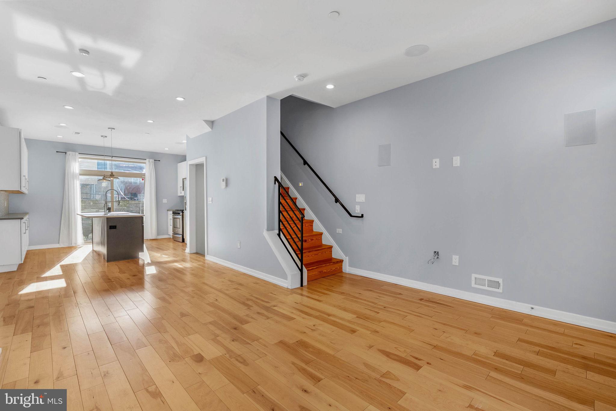 1912 Gerritt Street Philadelphia, PA 19146 - Photo 3 of 40 a view of an empty room with wooden floor and a window