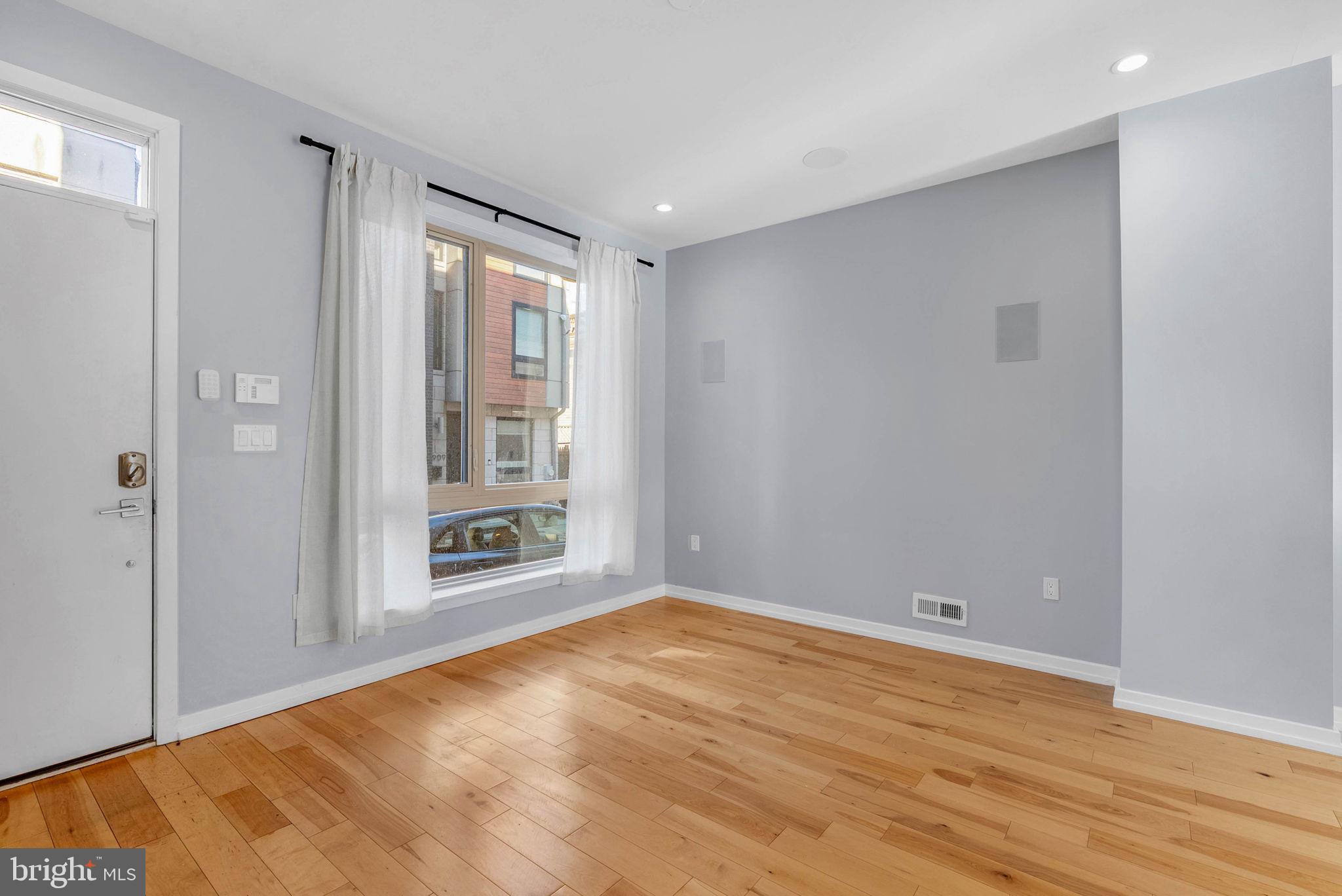 1912 Gerritt Street Philadelphia, PA 19146 - Photo 6 of 40 a view of an empty room with wooden floor and a window