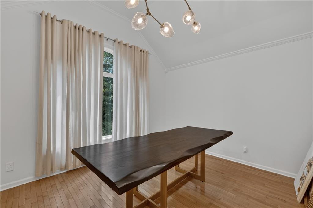 4610 West Morton Road Alpharetta, GA 30022 - Photo 17 of 53 an open room with wooden floor and windows