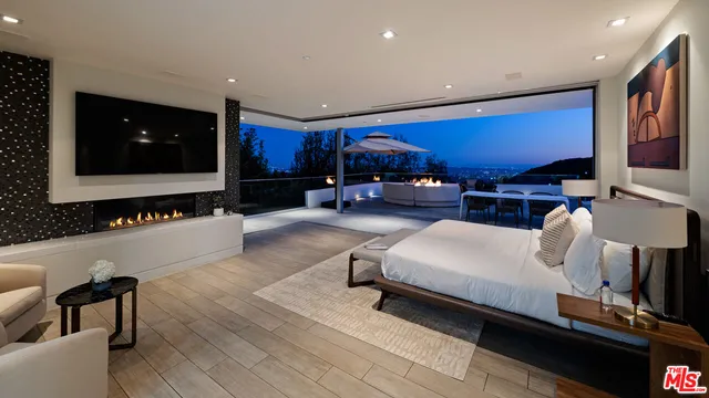 a bedroom with a bed and a night stand