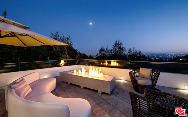 a bedroom with a bed couch and window