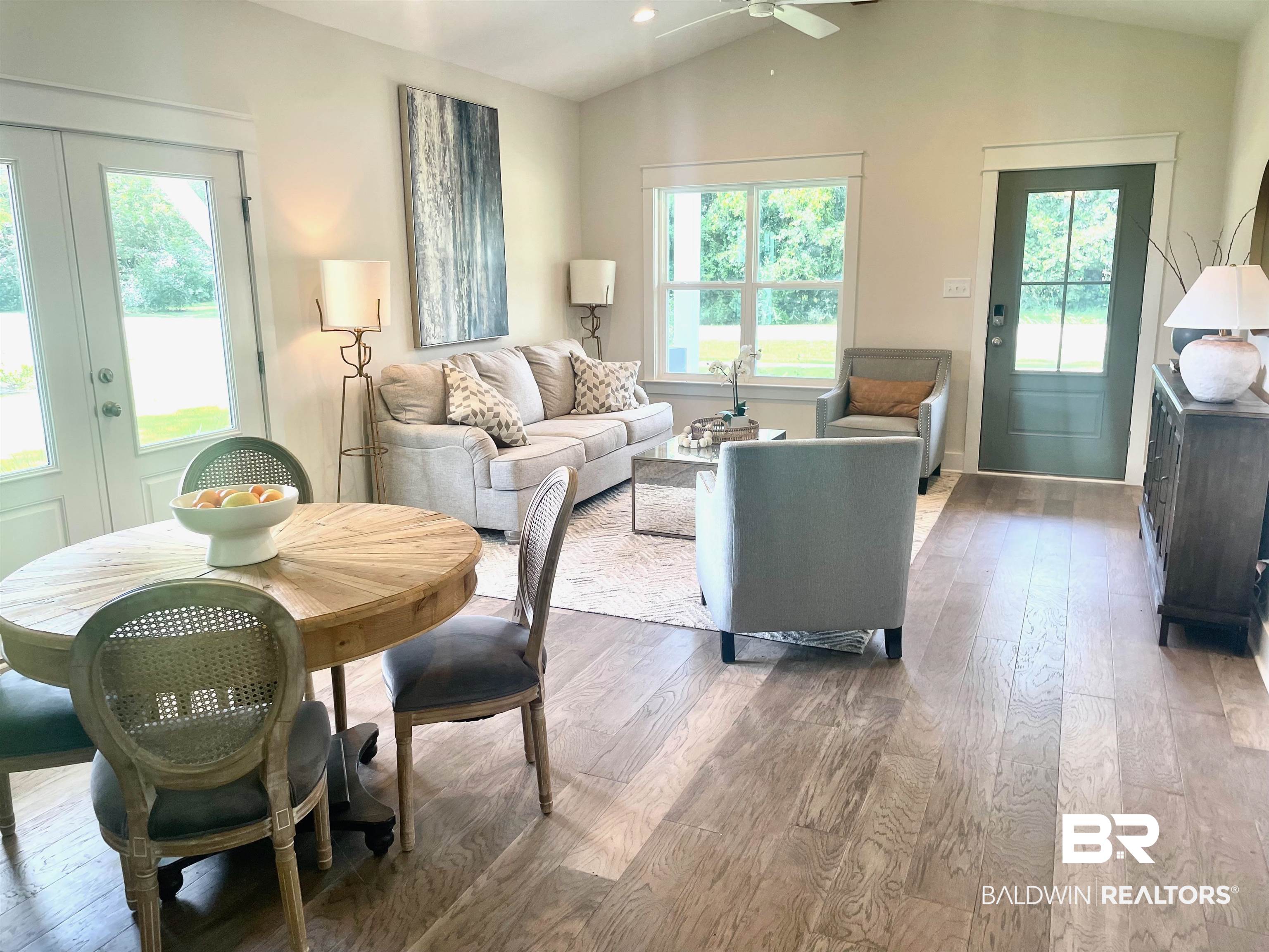 14710 Camelia Street Magnolia Springs, AL 36555 - Photo 3 of 23 Living room featuring ceiling fan, plenty of natural light, vaulted ceiling, and hardwood / wood-style floors