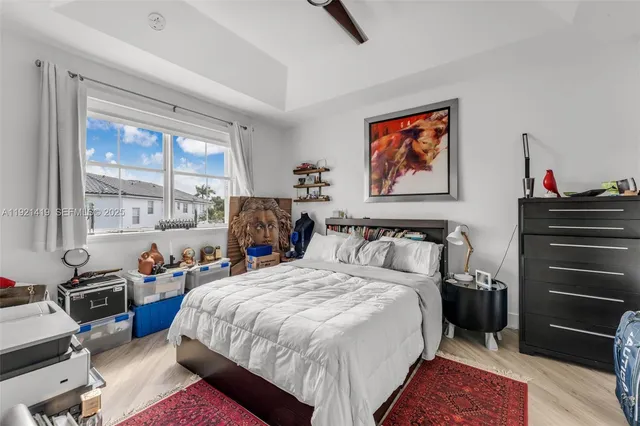 a bed room with a bed and a window