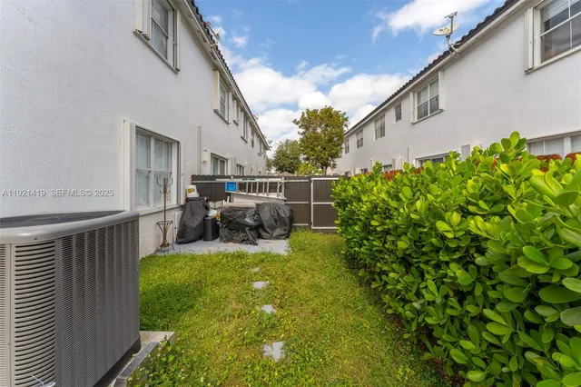 a view of a backyard with sitting area