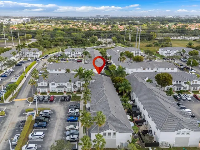 an aerial view of residential building and lake