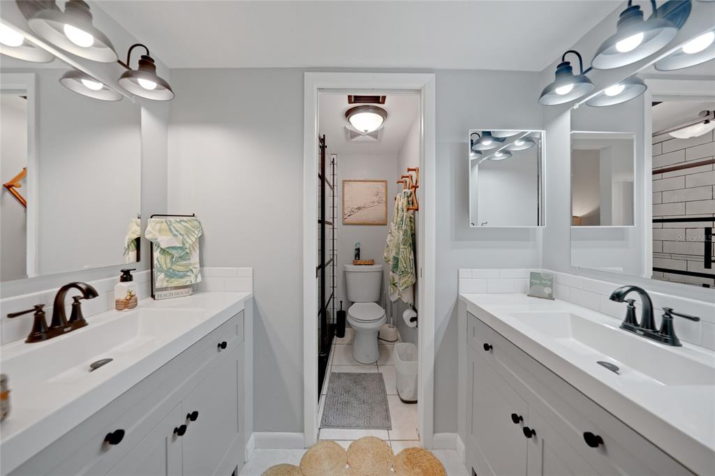 1591 Beach Road, Unit 202 Englewood, FL 34223 - Photo 16 of 46 a bathroom with a sink double vanity