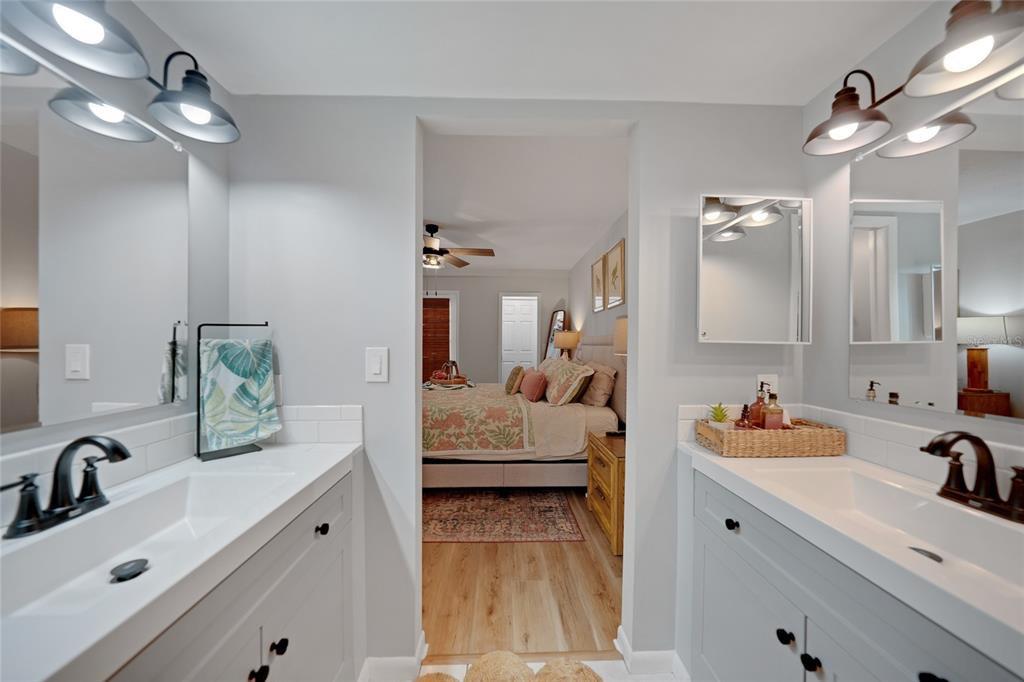 1591 Beach Road, Unit 202 Englewood, FL 34223 - Photo 17 of 46 a en suite bathroom with double sink and a mirror