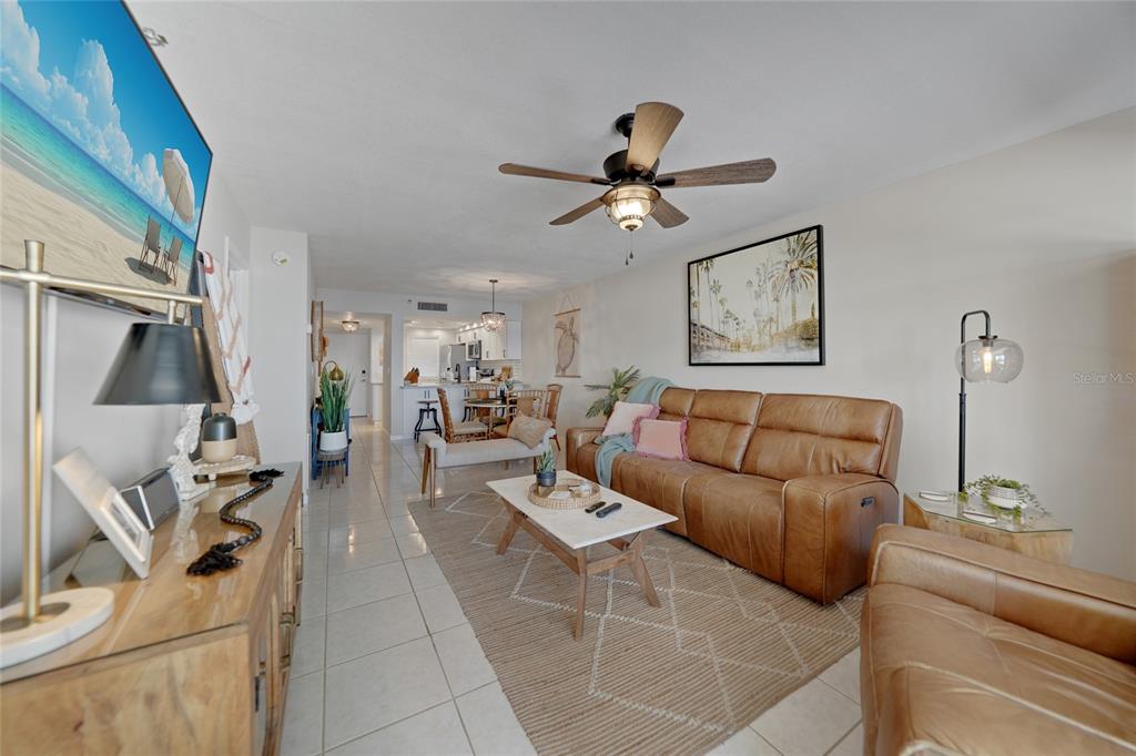 1591 Beach Road, Unit 202 Englewood, FL 34223 - Photo 2 of 46 a living room with furniture and a flat screen tv