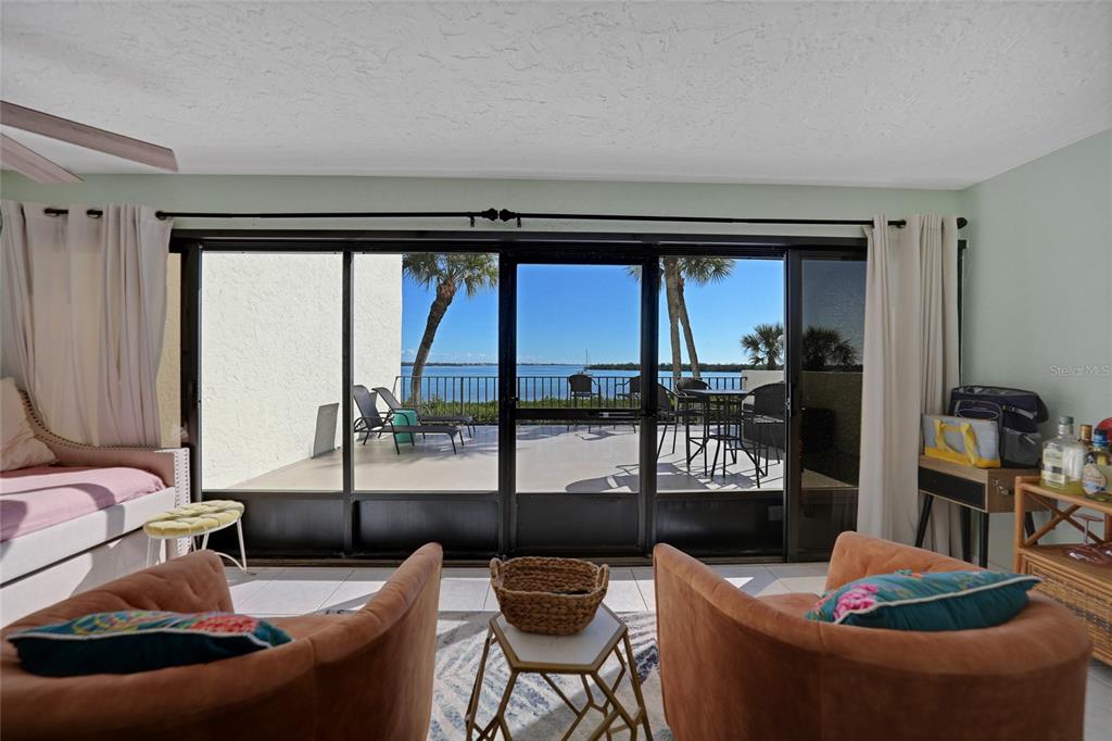 1591 Beach Road, Unit 202 Englewood, FL 34223 - Photo 24 of 46 a living room with furniture and a large window