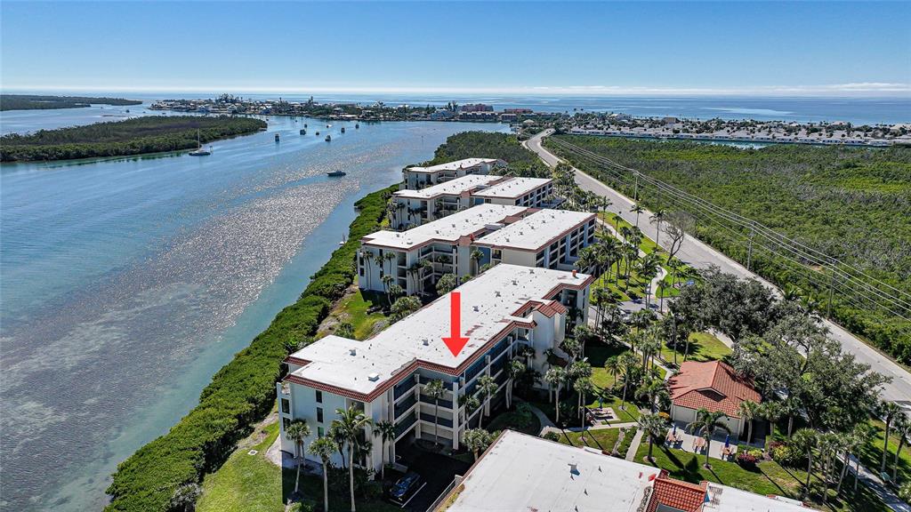 1591 Beach Road, Unit 202 Englewood, FL 34223 - Photo 41 of 46 an aerial view of houses with outdoor space