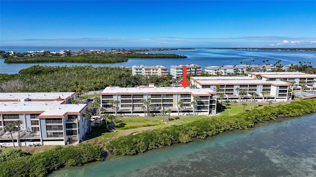 1591 Beach Road, Unit 202 Englewood, FL 34223 - Photo 42 of 46 a view of a city with tall buildings