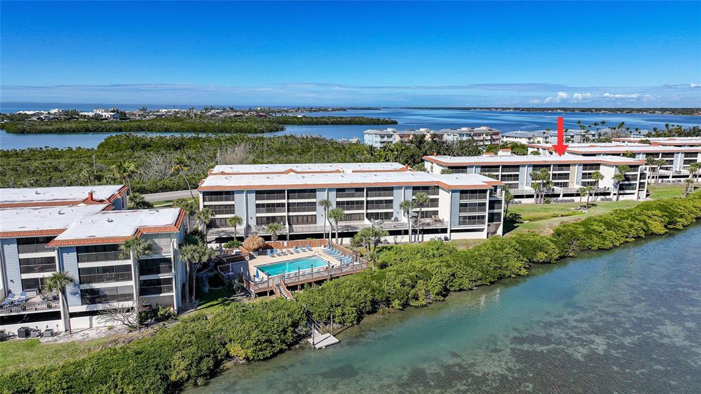 1591 Beach Road, Unit 202 Englewood, FL 34223 - Photo 43 of 46 a view of a big yard with an outdoor seating