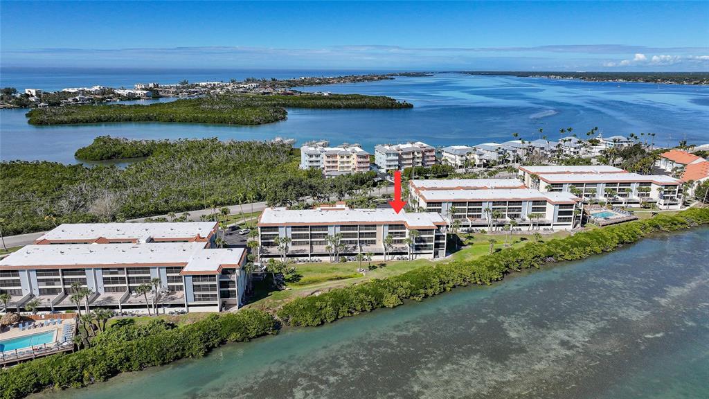 1591 Beach Road, Unit 202 Englewood, FL 34223 - Photo 44 of 46 a view of a city with an ocean view